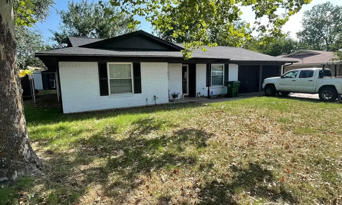 Professional roofing crew working on a residential roof in Prescott Valley